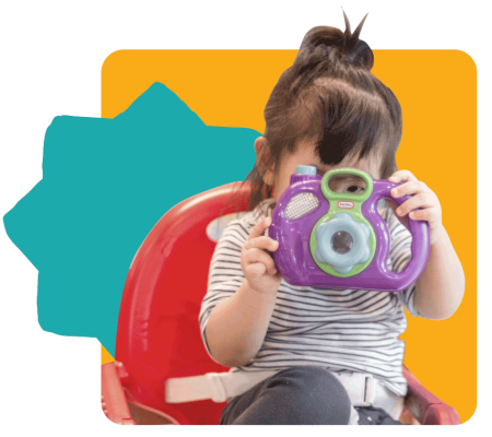 Child exploring with a camera